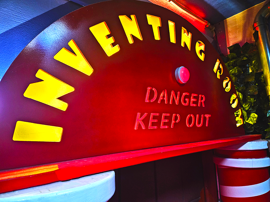 A photo of the Inventing Room Sign in the Billy Bonka and the Burst Bubble Escape Room at Conundrum